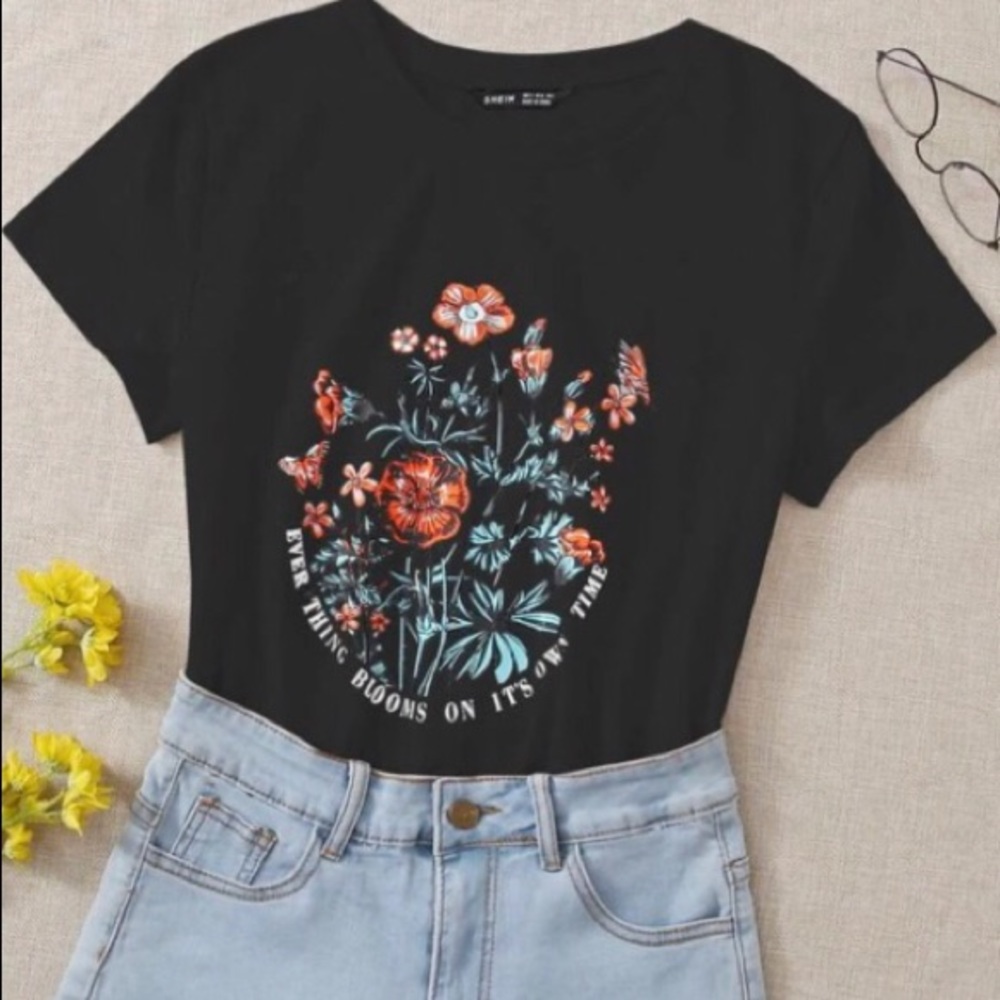 black tee with flower graphics